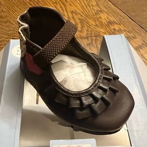 Robeez leather soft sole shoes brown with a pink heart.  Size is 0-6 months.